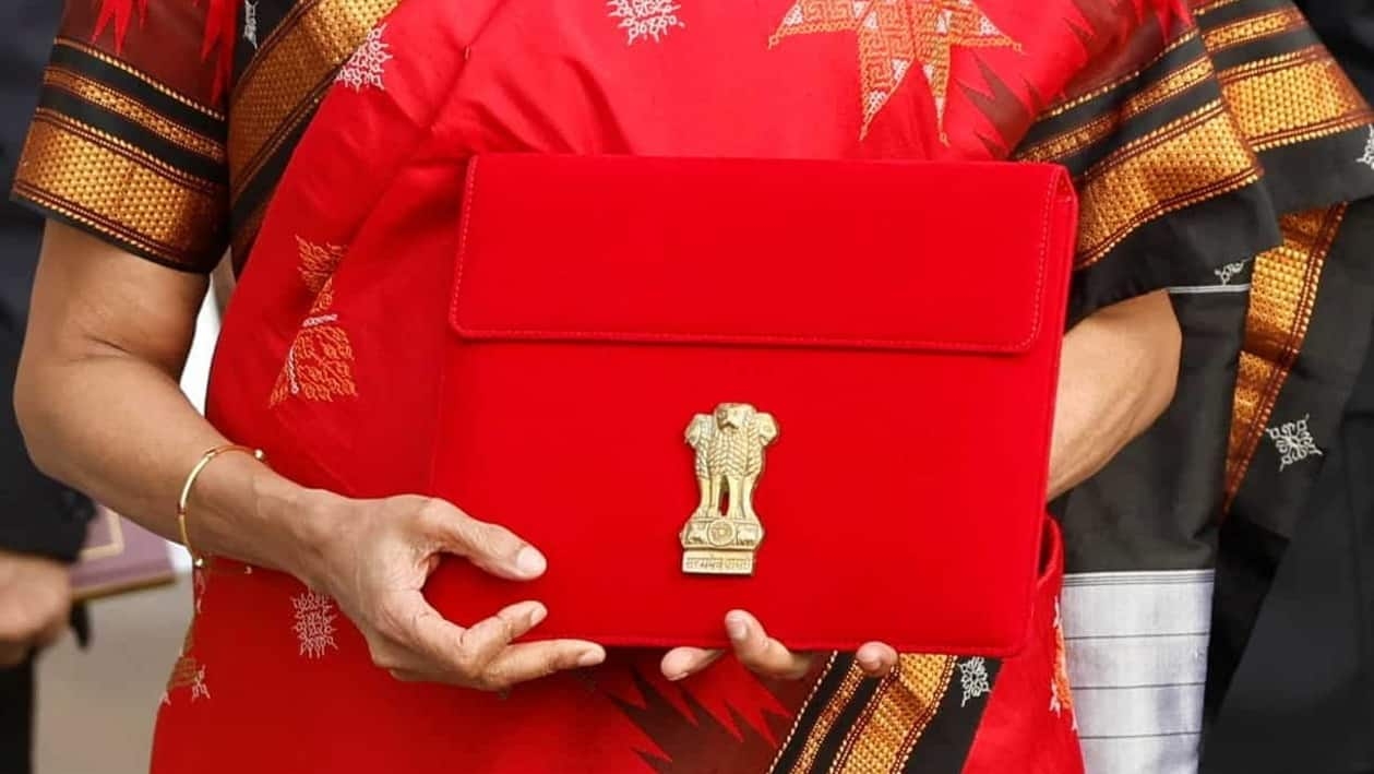 India's Finance Minister Nirmala Sitharaman holds up a folder with the Government of India?s logo as she leaves her office to present the federal budget in the parliament, in New Delhi, India, February 1, 2023. REUTERS/Adnan Abidi
