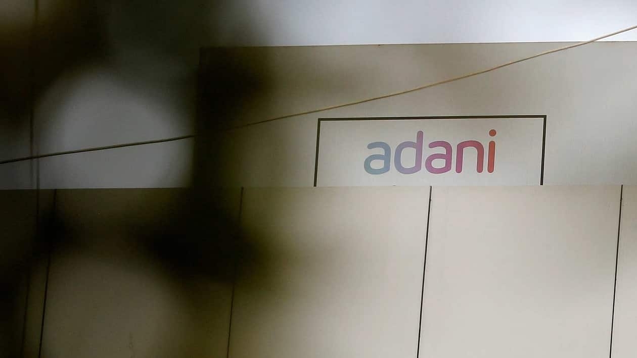 FILE PHOTO: The logo of the Adani Group is seen on one of its buildings in Ahmedabad, India, January  27, 2023. REUTERS/Amit Dave/File Photo