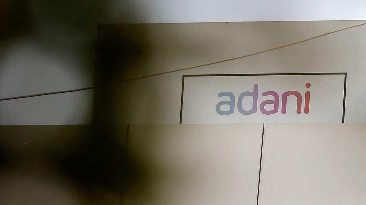 Adani Enterprises plunged 10 per cent to  <span class='webrupee'>₹</span>1,734.60 per share, its lower price band on the BSE, and the company's market valuation dropped to  <span class='webrupee'>₹</span>2.14 lakh crore.