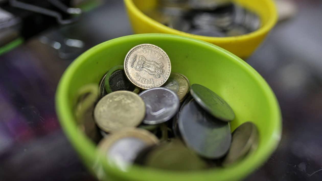 Indian rupee coins in a bowl arranged for a photograph at a general store in Mumbai, India, on Wednesday, July 20, 2022. The rupee slid to all-time low of 80.06 per dollar on Tuesday, and has lost 2.4% over the past month, the third-worst performing Asian currency over the period. Photographer: Dhiraj Singh/Bloomberg