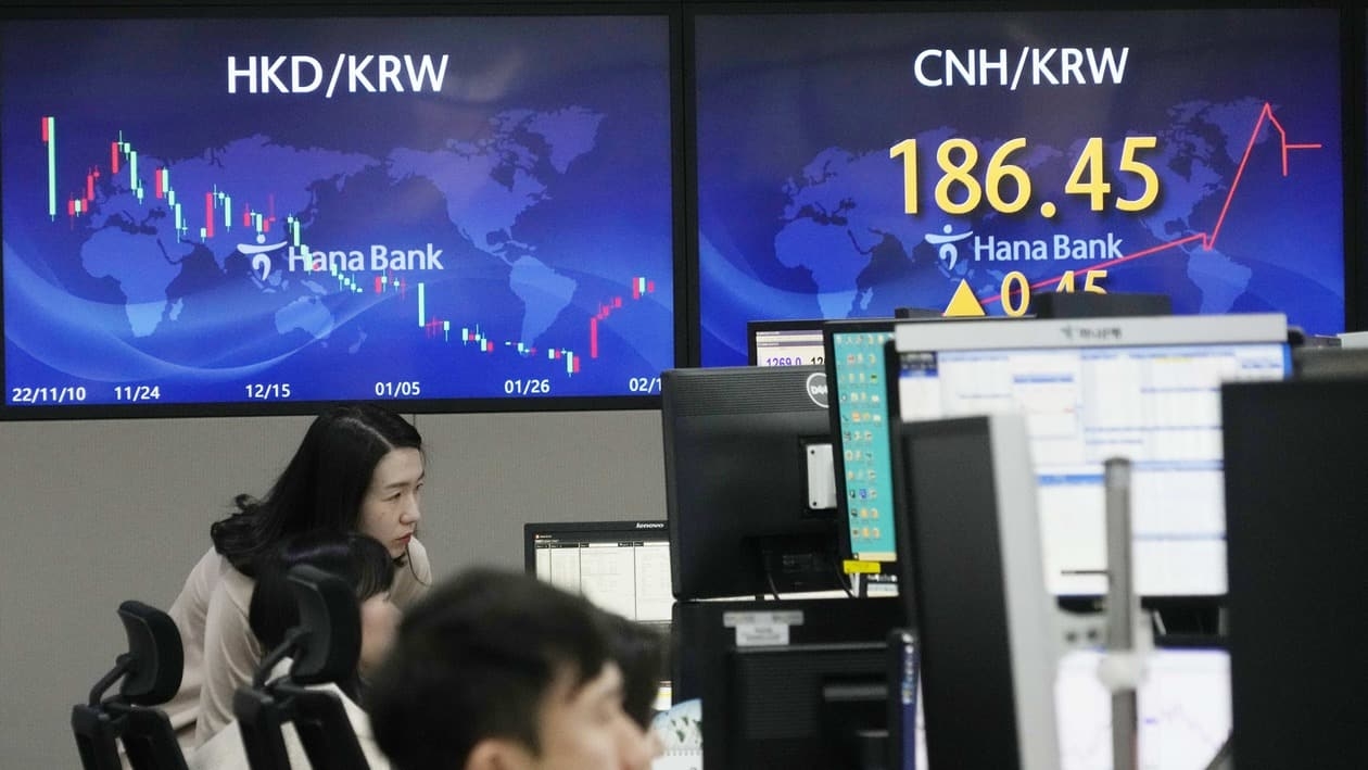 Currency traders watch monitors at the foreign exchange dealing room of the KEB Hana Bank headquarters in Seoul, South Korea, Wednesday, Feb. 15, 2023. Asian stock markets fell Wednesday after U.S. inflation edged down less than expected, fueling concern the Federal Reserve might think more interest rate hikes are needed. (AP Photo/Ahn Young-joon)