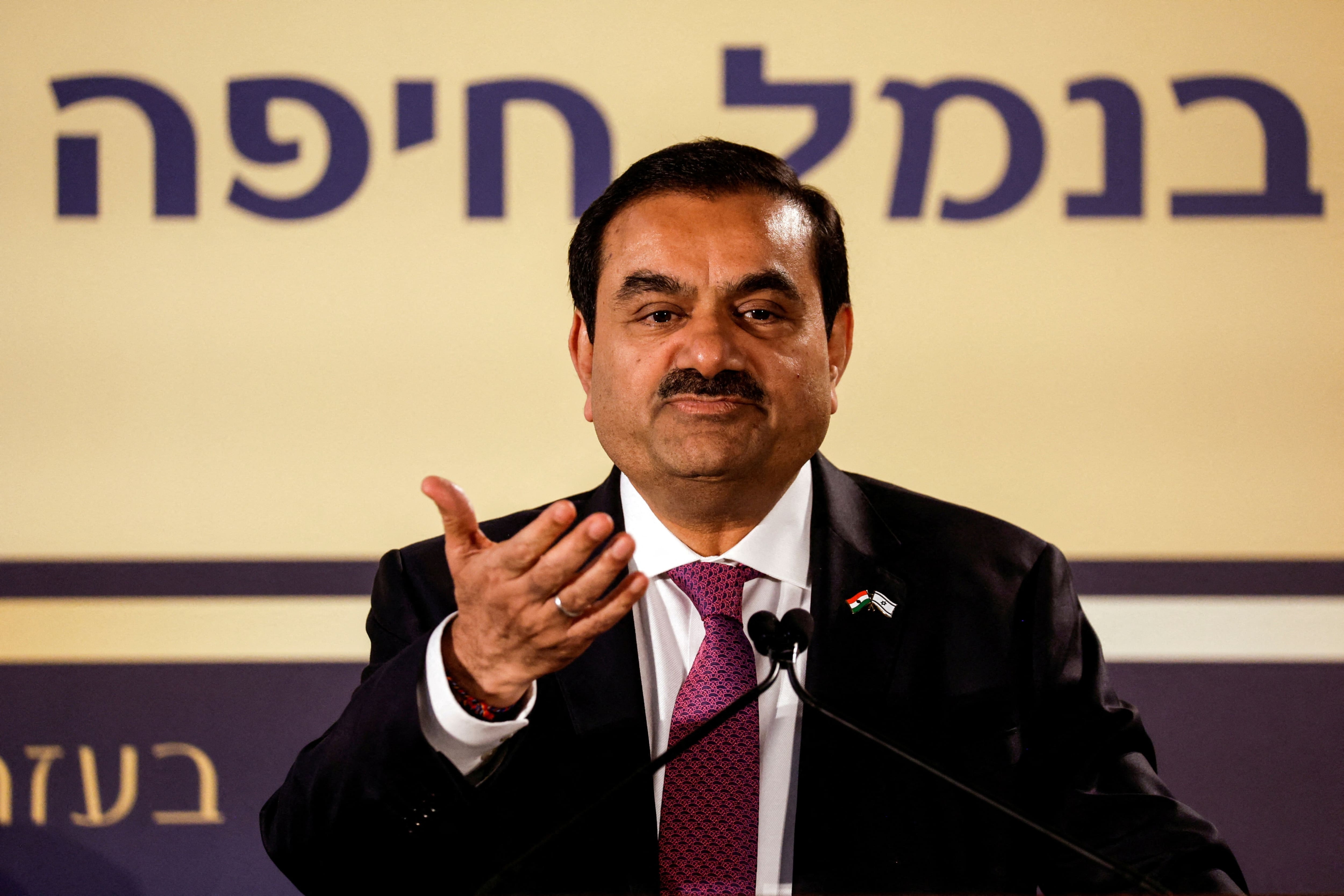 FILE PHOTO: Indian billionaire Gautam Adani speaks during an inauguration ceremony after the Adani Group completed the purchase of Haifa Port earlier in January 2023, in Haifa port, Israel January 31, 2023. REUTERS/Amir Cohen/File Photo