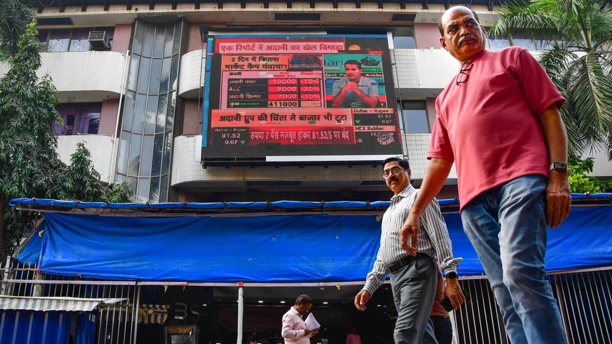 Mumbai: Pedestrians walk past the Bombay Stock Exchange (BSE) building, in Mumbai, Friday, Jan. 27, 2023. Equity benchmarks Sensex and Nifty plunged over 1 per cent for a second straight session on Friday, Jan. 27, 2023. (PTI Photo)(PTI01_27_2023_000240B)