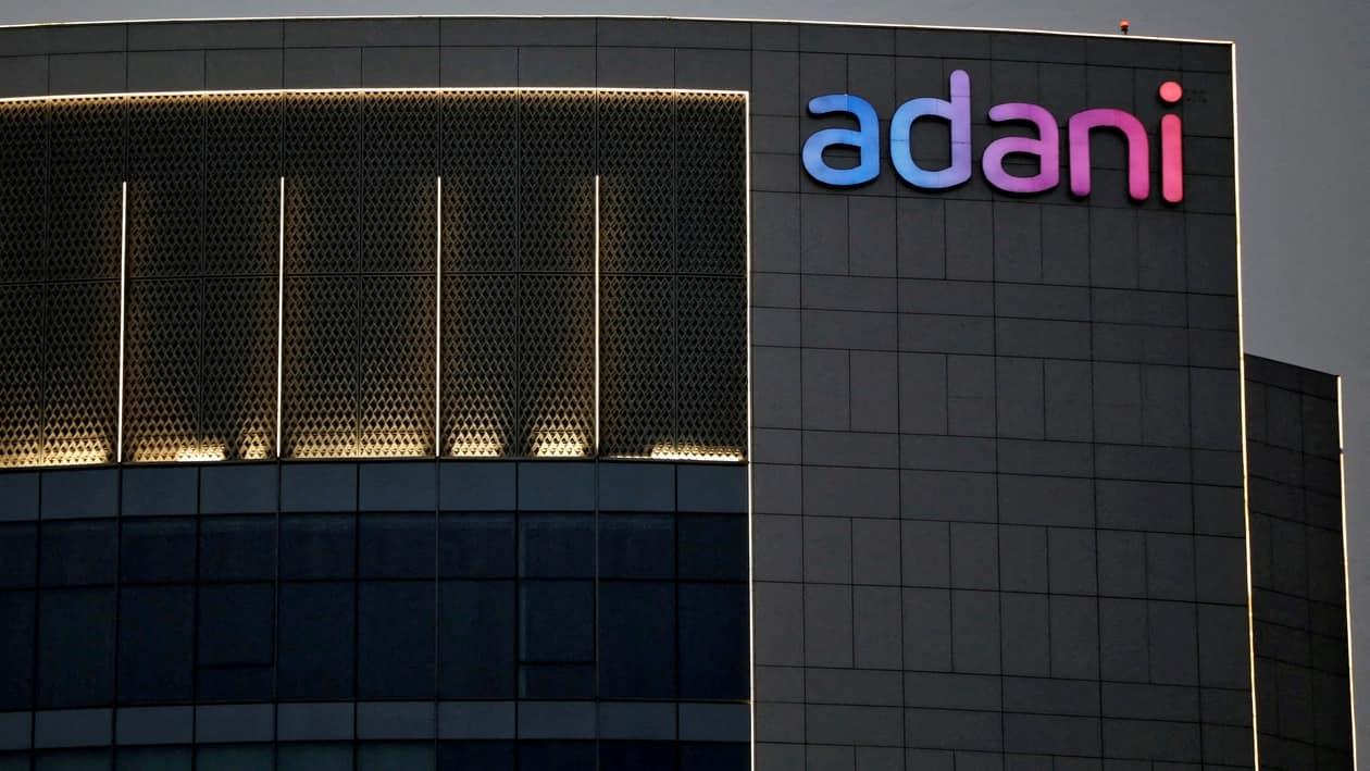 FILE PHOTO: The logo of the Adani group is seen on the facade of one of its buildings on the outskirts of Ahmedabad, India, April 13, 2021. REUTERS/Amit Dave/File Photo