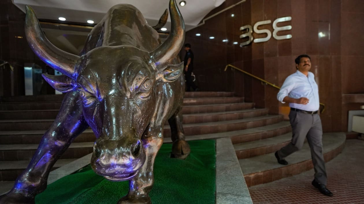 Mumbai: A man walks past the BSE bull on the day of tabling of Union Budget 2023-24, at Bombay Stock Exchange in Mumbai, Wednesday, Feb. 1, 2023. With Budget announcements the 30-share BSE benchmark Sensex rose 1,000 points to touch an intra-day high of 60,1618 points but later pared down to 59,257, after dropping 450 points. (PTI Photo/Shashank Parade) (PTI02_01_2023_000222B)